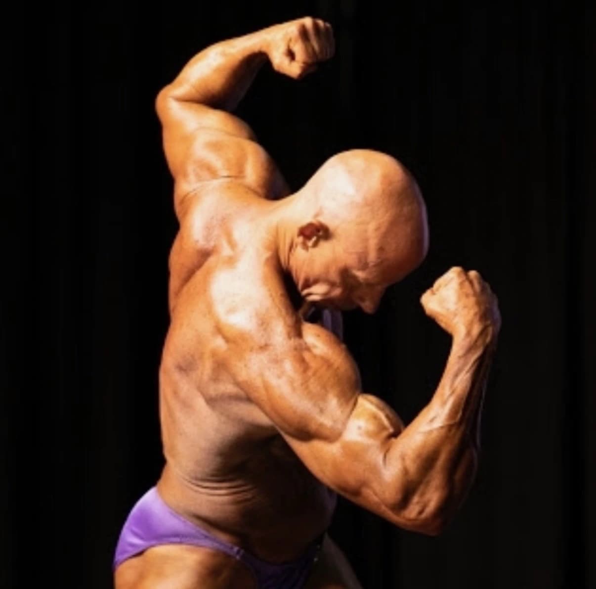 Theo Thurston flexing during a bodybuilding pose